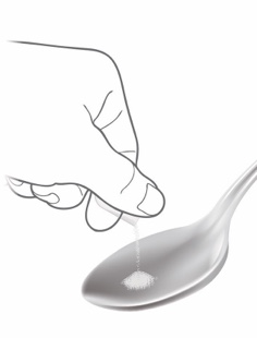 Sprinkling Alkindi Sprinkle granules onto spoon without food
