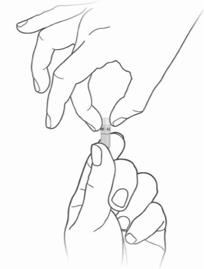Hands twisting off the top of an Alkindi Sprinkle capsule